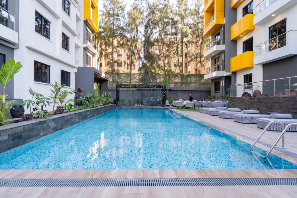 The pool and lounge area of one of our properties in Kenya, Wilma Towers showing the water feature and barbacue area in the background. Such features set a development apart in an area like Kololo.
